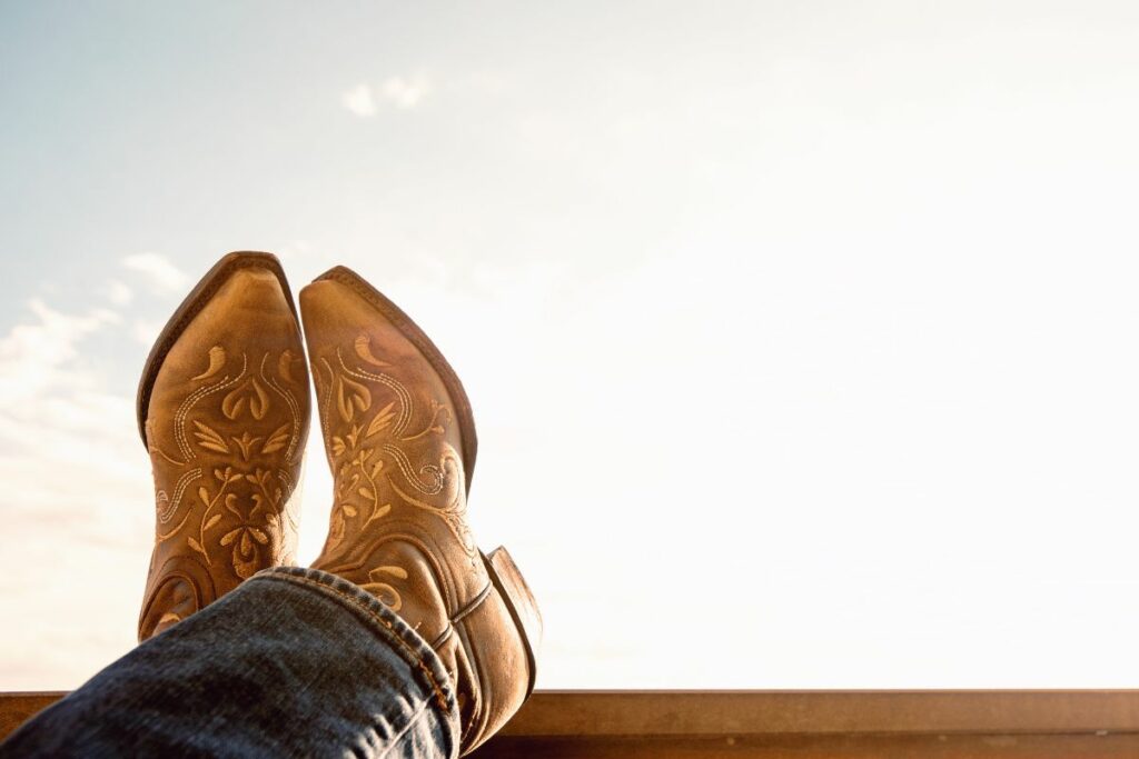 Man With Cowboy Boots Propped Up